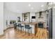 Spacious kitchen features an island with bar seating, ample natural light, and modern appliances at 2400 Ventress Ct, Bennett, CO 80102