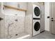Contemporary laundry room featuring a dog shower, modern appliances and lots of storage at 2400 Ventress Ct, Bennett, CO 80102