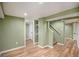 Finished basement area with painted walls, recessed lighting, and wood-look floors at 1449 Clinton St, Aurora, CO 80010