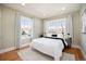 Serene bedroom with hardwood floors, natural light and modern decor at 1449 Clinton St, Aurora, CO 80010