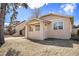 Charming single-Gathering home with covered front porch and manicured lawn at 1449 Clinton St, Aurora, CO 80010