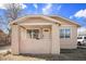 Charming single-story home featuring a covered front porch and neutral stucco exterior at 1449 Clinton St, Aurora, CO 80010