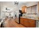 Open kitchen view with stainless steel appliances and natural light at 1449 Clinton St, Aurora, CO 80010