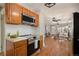 Spacious kitchen with stainless steel appliances and hardwood floors at 1449 Clinton St, Aurora, CO 80010