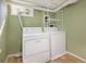 Basement laundry room with washer and dryer hookups and a utility sink at 1449 Clinton St, Aurora, CO 80010