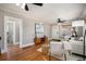 Cozy living room with hardwood floors, ceiling fan, and neutral color palette at 1449 Clinton St, Aurora, CO 80010
