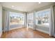 Bright living room featuring hardwood floors and large windows with white trim at 1449 Clinton St, Aurora, CO 80010
