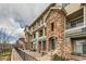 Attractive condo building with beautiful stone facade and private covered entry at 452 Black Feather Loop # 612, Castle Rock, CO 80104