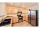 Kitchen features stainless steel appliances, ample cabinet space and recessed lighting at 452 Black Feather Loop # 612, Castle Rock, CO 80104