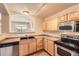 The open concept kitchen area overlooks the living space with stainless steel appliances at 452 Black Feather Loop # 612, Castle Rock, CO 80104