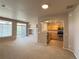 Bright living room with natural light, balcony access, and an open flow into the adjacent kitchen area at 452 Black Feather Loop # 612, Castle Rock, CO 80104