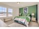 Well-lit bedroom featuring a bold green and white color scheme, mountain views, and a bench at 13838 Honey Hush Trl, Parker, CO 80134