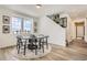 Bright dining area with a large window, stylish decor, and a modern table setting for meals at 13838 Honey Hush Trl, Parker, CO 80134
