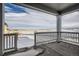 Covered patio overlooking a snow-covered yard, community, and open space at 13838 Honey Hush Trl, Parker, CO 80134