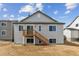 Backyard view of a two-story home with a deck and unfinished landscaping at 39172 Clymer St, Elizabeth, CO 80107