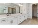 Elegant bathroom features dual sinks, quartz counters, modern fixtures, and a large walk-in shower at 39172 Clymer St, Elizabeth, CO 80107