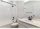 Modern bathroom with white subway tile, a shower with black fixtures, and a quartz vanity at 39172 Clymer St, Elizabeth, CO 80107