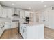 Well-appointed kitchen with modern appliances, a large island, stylish cabinets, and a sleek range hood at 39172 Clymer St, Elizabeth, CO 80107