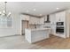 Modern kitchen featuring stainless steel appliances, an island, and shaker style cabinets at 39172 Clymer St, Elizabeth, CO 80107