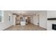 Bright and airy open floor plan seamlessly connecting the living area and modern kitchen space at 39172 Clymer St, Elizabeth, CO 80107