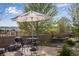 Brick patio with seating, table, grill, garden and a beautiful view at 4000 Donnington Cir, Castle Rock, CO 80104