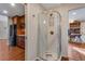 Bright bathroom featuring shower enclosure and access to kitchen and storage spaces at 4000 Donnington Cir, Castle Rock, CO 80104