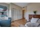 Bedroom showcasing a spacious closet, hardwood floors and a chair at 4000 Donnington Cir, Castle Rock, CO 80104