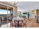 Dining area with glass table and chairs, leading to an outdoor patio at 4000 Donnington Cir, Castle Rock, CO 80104