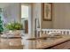 Close-up of kitchen island with granite countertops and stainless steel faucet at 4000 Donnington Cir, Castle Rock, CO 80104