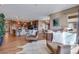 Inviting living room showcasing an open layout, seamlessly connecting to the kitchen and dining area at 4000 Donnington Cir, Castle Rock, CO 80104