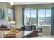 Bright living room with large windows, comfortable seating, and hardwood floors at 4000 Donnington Cir, Castle Rock, CO 80104