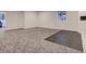 Unfinished basement with new carpet, tiled area, and windows, waiting for your finishing touches at 10197 E Mississippi Ave, Denver, CO 80247