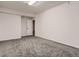 This bedroom features neutral carpeting, white trim and neutral color palette at 10197 E Mississippi Ave, Denver, CO 80247
