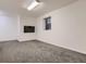 The neutral bedroom includes carpeting, base trim and a small window for natural light at 10197 E Mississippi Ave, Denver, CO 80247