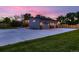 The home features a large driveway and a large three-car garage at 10197 E Mississippi Ave, Denver, CO 80247