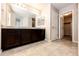Bathroom boasts granite countertop, modern cabinets, and tile floors for a clean and elegant design at 16075 E Elk Pl, Denver, CO 80239