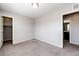 Bright bedroom featuring carpet, a neutral palette, and access to the bathroom and closet, making it serene and inviting at 16075 E Elk Pl, Denver, CO 80239