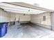 Spacious garage with a rear entry door and concrete flooring, offering ample storage at 16075 E Elk Pl, Denver, CO 80239