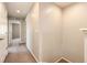 Neutral hallway with carpet and doorways to other rooms, creating a seamless transition throughout the home at 16075 E Elk Pl, Denver, CO 80239