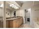 Bathroom with a double sink vanity with granite counters and a view to the closet at 4001 W 32Nd Ave # 1, Denver, CO 80212