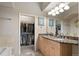 Bathroom with a double vanity and walk-in closets at 4001 W 32Nd Ave # 1, Denver, CO 80212