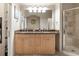 Bathroom with a double sink vanity with granite counters and a glass shower at 4001 W 32Nd Ave # 1, Denver, CO 80212