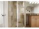 Elegant bathroom features a glass-enclosed shower and granite vanity at 4001 W 32Nd Ave # 1, Denver, CO 80212