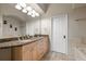 Bathroom boasts double sinks, granite counters, and great lighting at 4001 W 32Nd Ave # 1, Denver, CO 80212