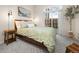 Bright bedroom with a queen sized bed, carpet, and a sliding glass door at 4001 W 32Nd Ave # 1, Denver, CO 80212
