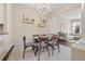 Elegant dining room features modern chandelier and furniture, neutral walls, and hardwood floors with an open floor plan at 4001 W 32Nd Ave # 1, Denver, CO 80212