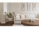 Comfortable living room with a sectional couch and wood floors at 4001 W 32Nd Ave # 1, Denver, CO 80212