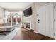 Living room featuring wood floors, a modern fireplace, and a glass sliding door to a private patio at 4001 W 32Nd Ave # 1, Denver, CO 80212