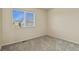 A sunlit bedroom with soft carpet and a large window, creating a bright and airy feel at 21422 E 47Th Ave, Denver, CO 80249