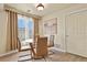 Elegant dining area with round glass table and modern chairs at 21422 E 47Th Ave, Denver, CO 80249